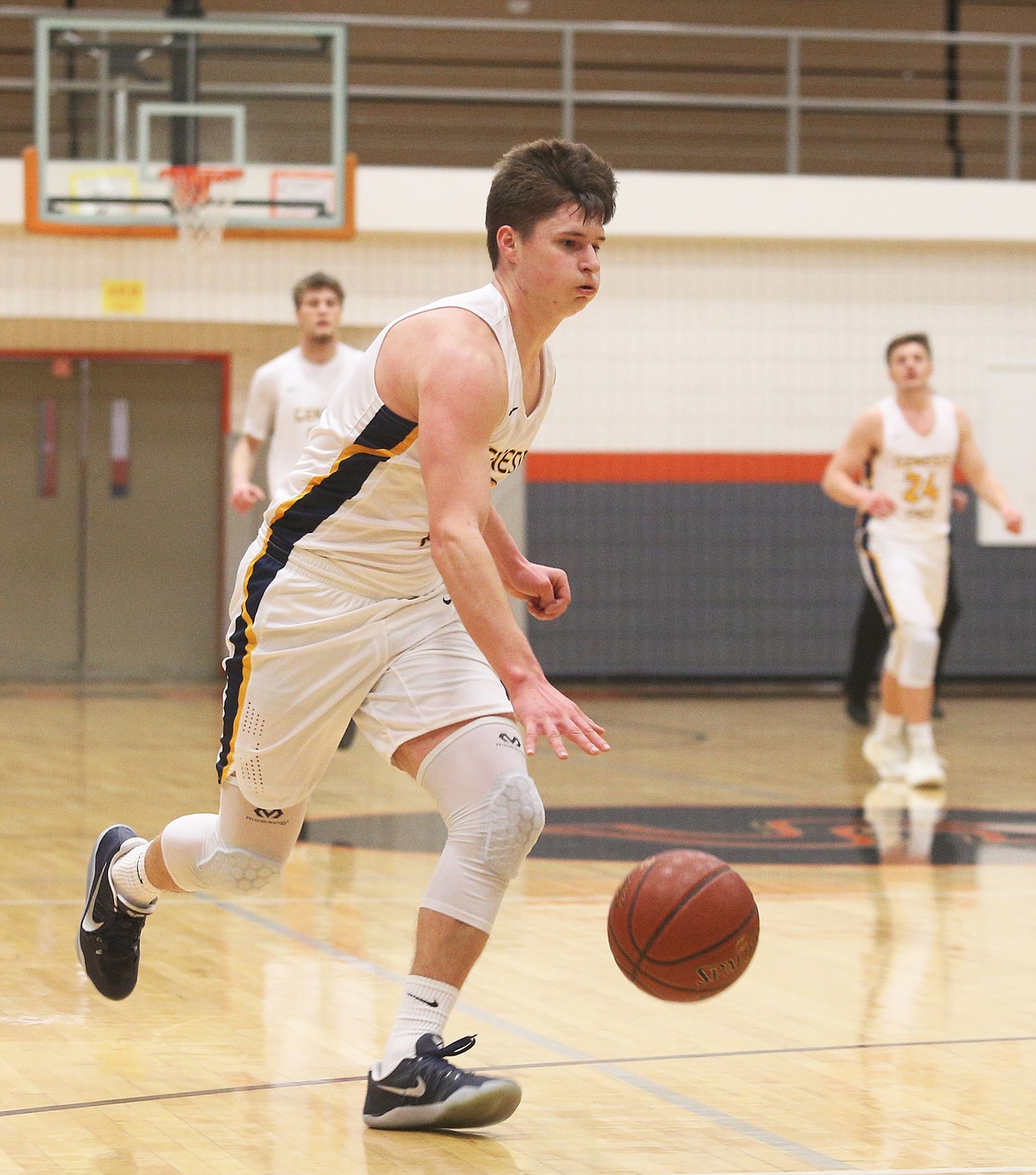 Genesis Prep guard Jacob Schultz dribbles against Kootenai.