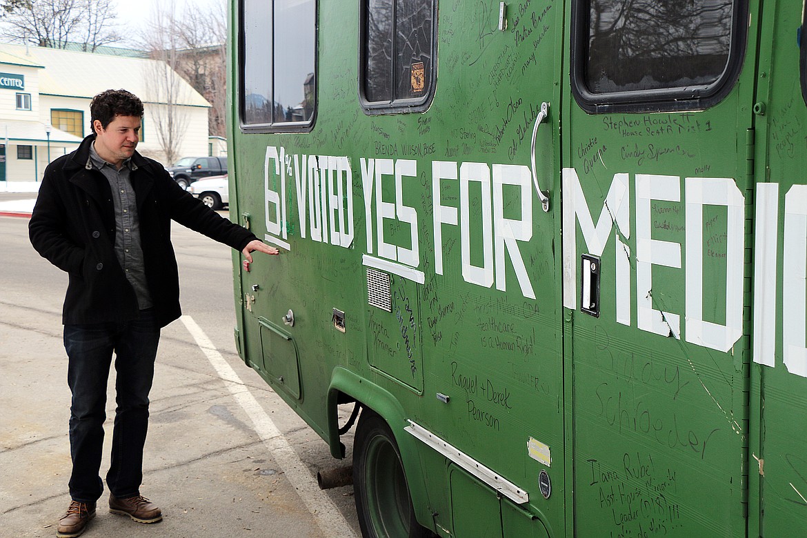 (File photo/CAROLINE LOBSINGER)
Reclaim Idaho&#146;s Luke Mayville checks out the revised slogan on the group&#146;s RV before driving down to Boise for a Monday rally. On Tuesday, the Idaho Supreme Court ruled Medicaid expansion in Idaho is legal.