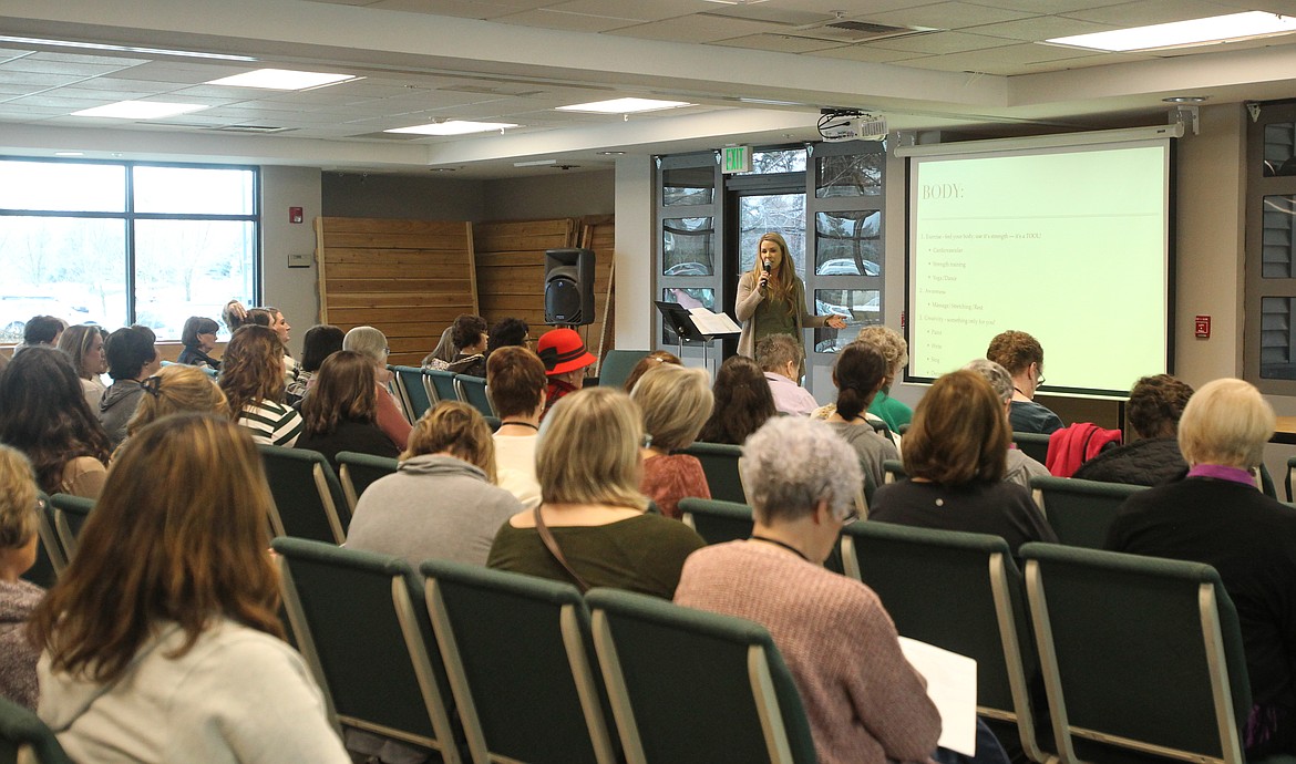 Tammy Strait of Hayden shares the importance of health in the body, mind and soul during a breakout session of the Breathe women's conference in Lake City Community Church on Saturday. (DEVIN WEEKS/Press)