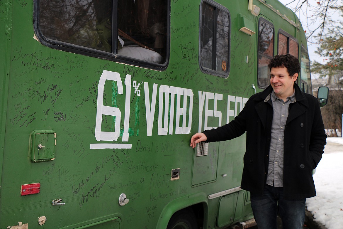 CAROLINE LOBSINGER/Hagadone News Network
Reclaim Idaho&#146;s Luke Mayville checks out the revised slogan on the group&#146;s RV that he&#146;s driving to Boise for a Monday rally calling on legislators to enact Medicaid expansion as voters approved, and without restrictions. Mayville, who didn&#146;t want to wipe out signatures written by supporters during the original cross-state journeys, joked he made the change with less than a dollar&#146;s worth of tape.