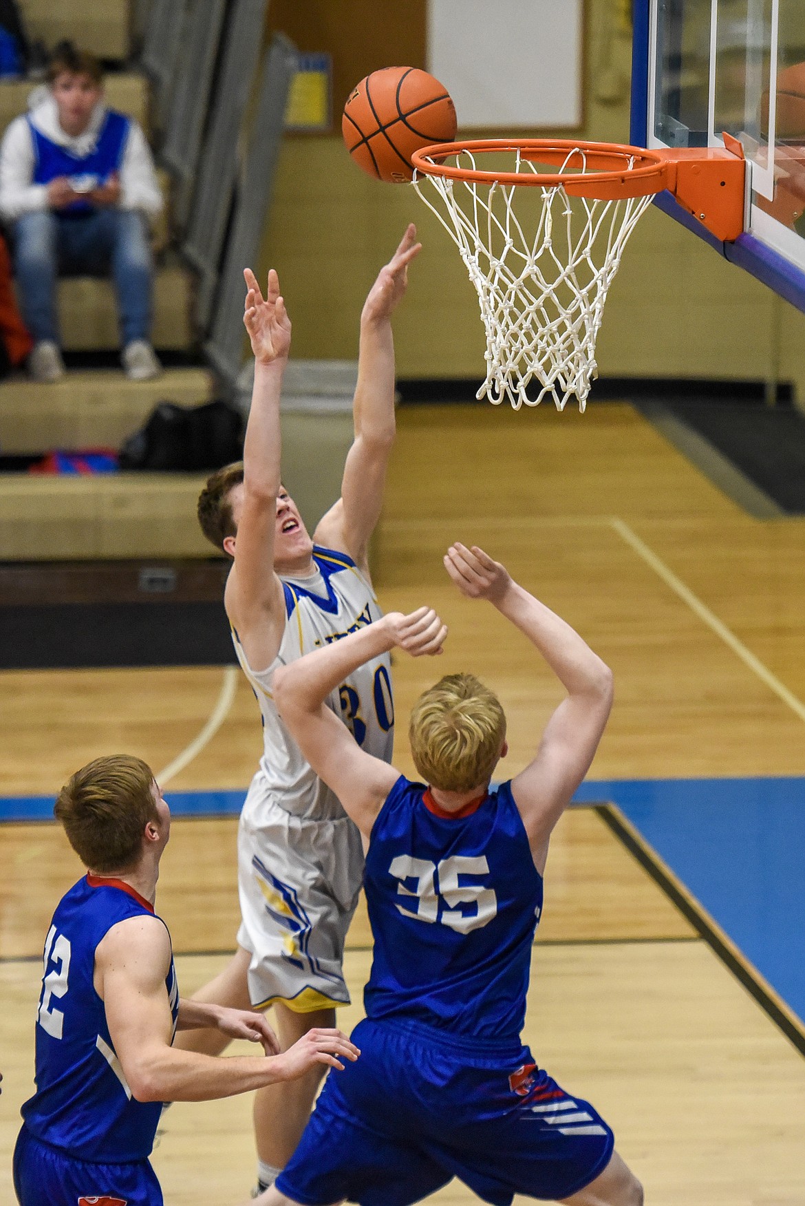 Libby freshman Caden Williams makes a layup early in the second quarter Friday against Columbia Falls. (Ben Kibbey/The Western News)
