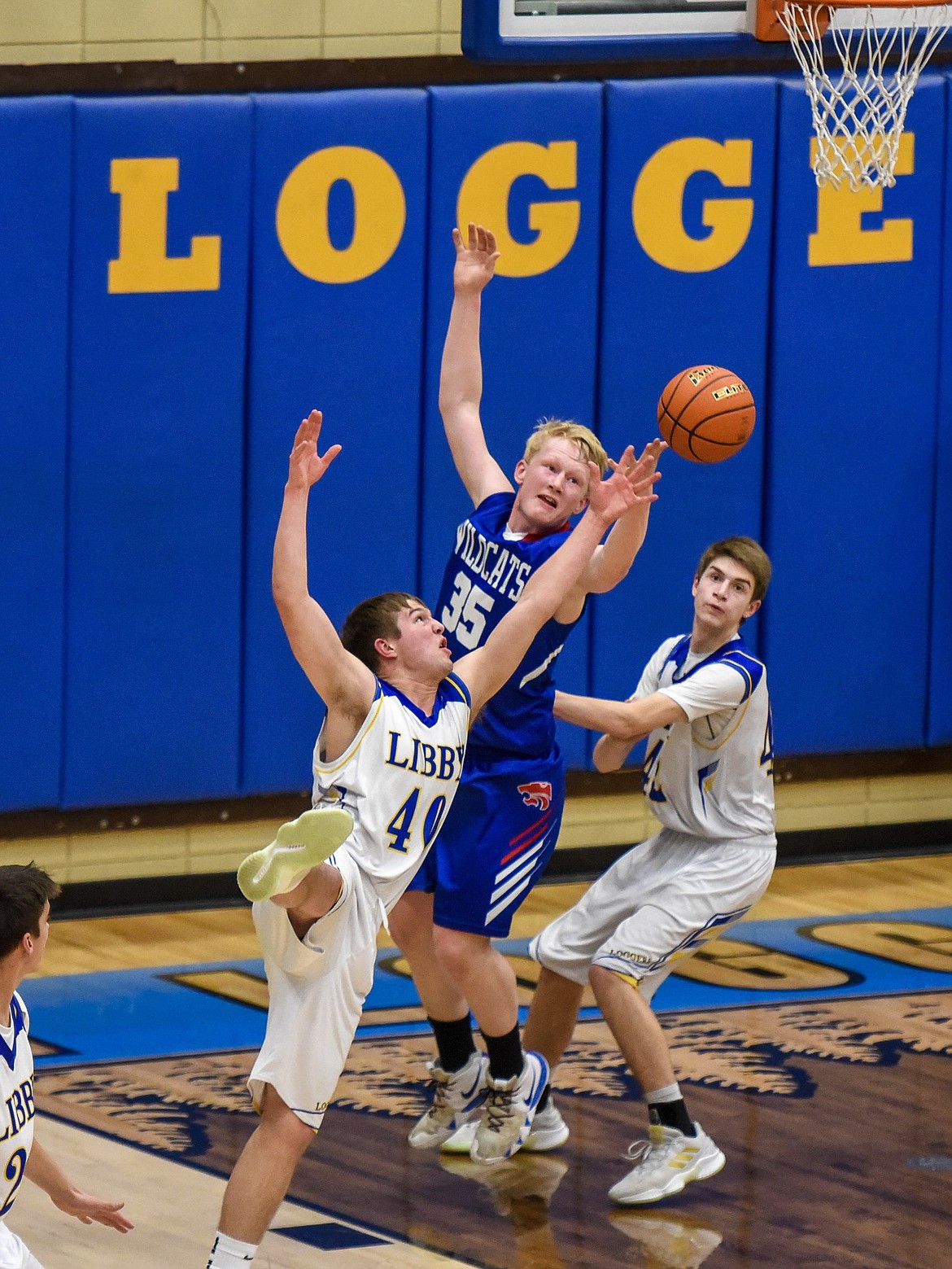 Libby senior Tim Goodman knocks away a pass from Columbia Falls senior Sam Hovde in the first quarter just before the buzzer Friday against Columbia Falls. (Ben Kibbey/The Western News)