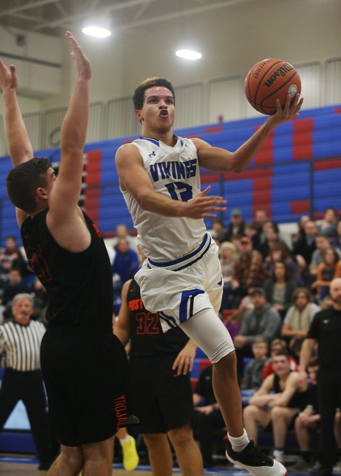 Coeur d'Alene's Devon Johnson drives towards the basket in the first half of Thursday night's game against Post Falls. (LOREN BENOIT/Press)