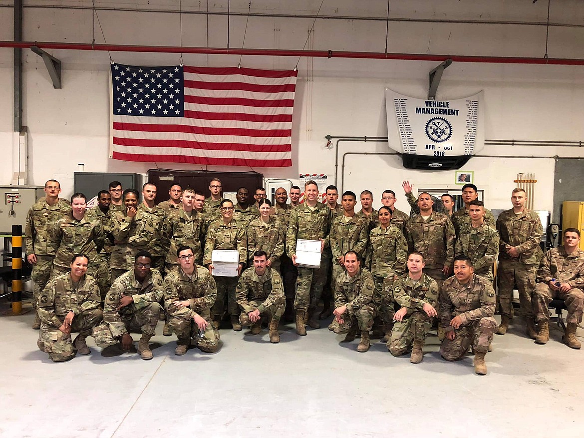 Photo courtesy of SHARON HOWARD
The 380th Air Expeditionary Wing currently stationed in the United Arab Emirates. The airmen, showing a couple of the care packages, sent this photo to the Wallace Elks Lodge as a thank you for the gifts. Staff Sergeant Keaton Robbins, Howard’s squadron contact and son-in-law, is in the center of the group holding one of the packages.