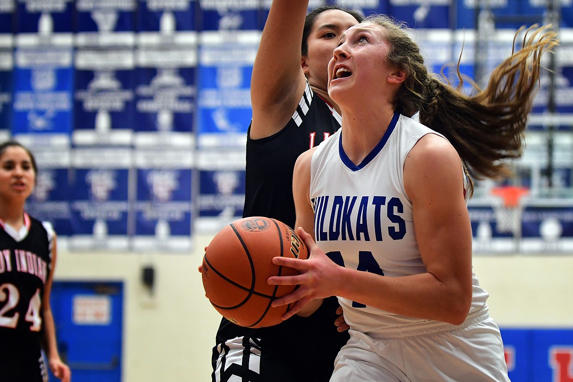 Josie Windauer takes the ball to the basket against the Lady Indians Saturday. (Jeremy Weber photo)