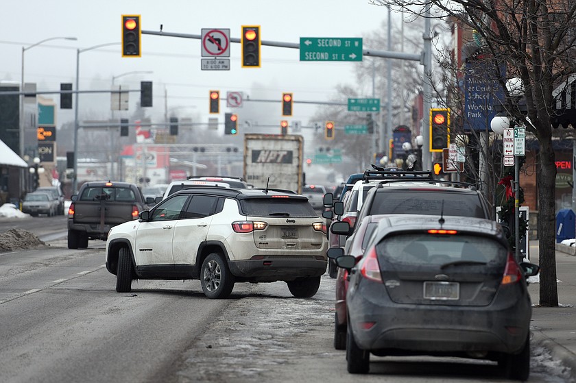 A driver parallel-parks along South Main Street in downtown Kalispell in this Jan. 30, 2019, file photo. (Casey Kreider/Daily Inter Lake)