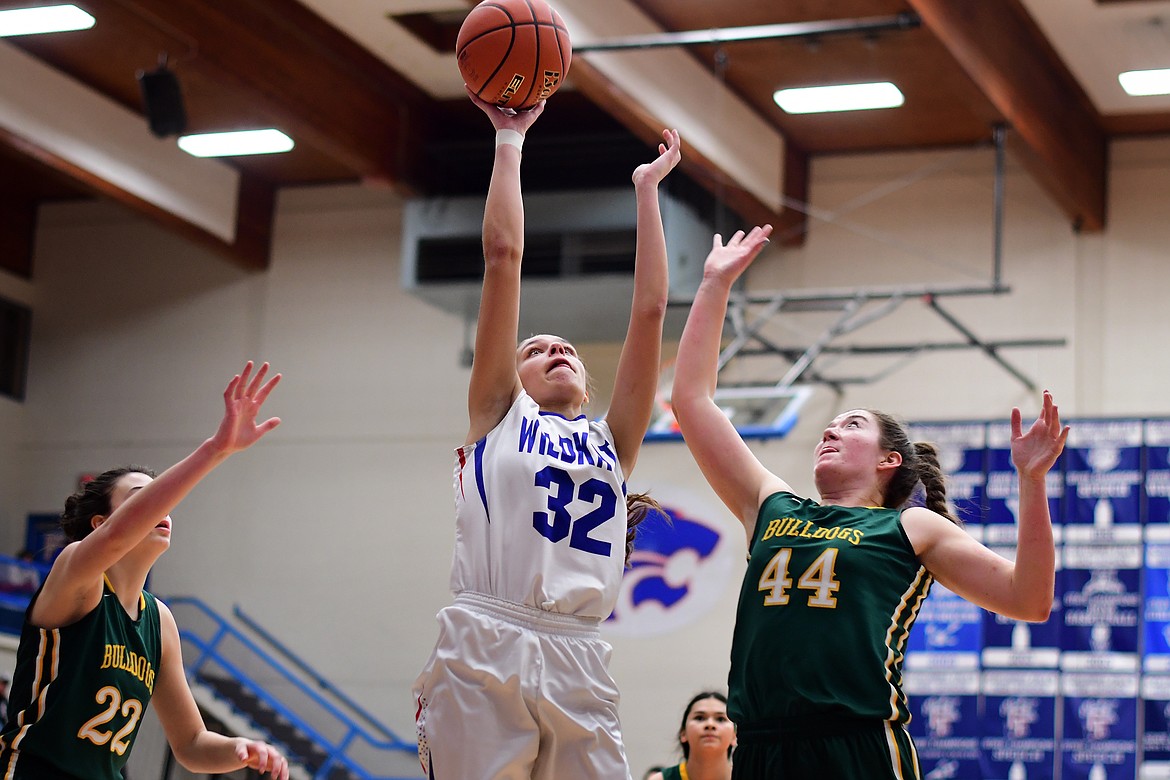 LaKia Hill goes up for a jumper over Whitefish&#146;s Marlee Bender Thursday. (Jeremy Weber photo)