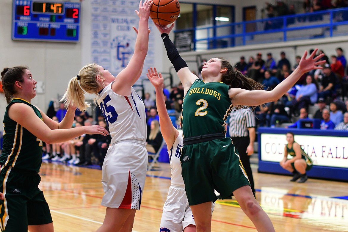 Trista Cowan battles Whitefish&#146;s Kaiah Moore for a rebound Thursday. (Jeremy Weber photo)