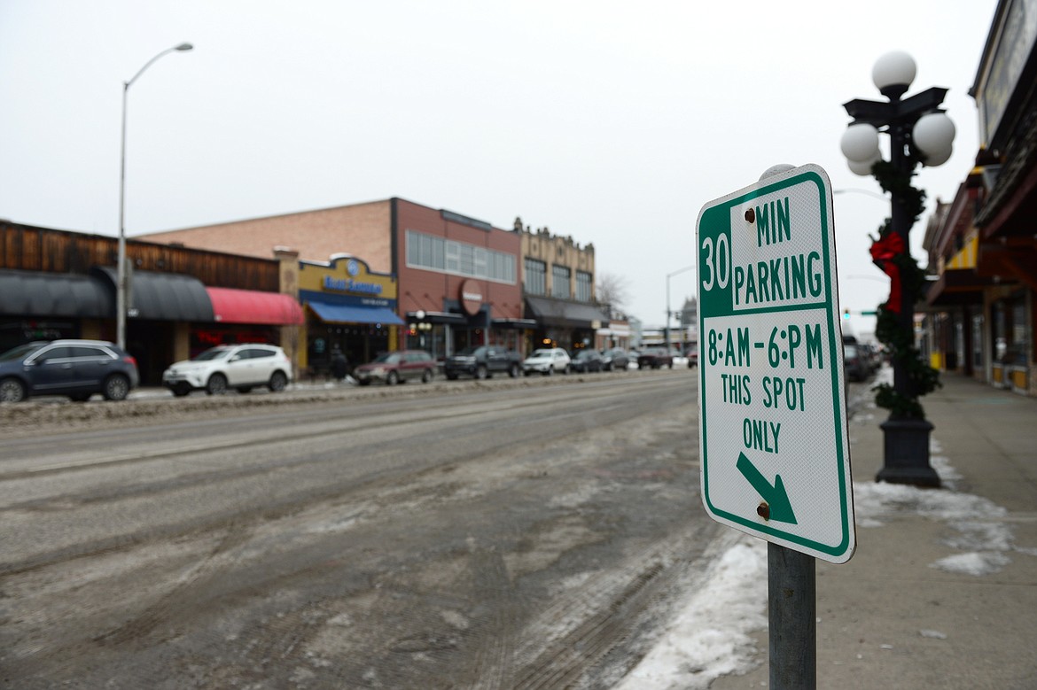 Signage and several open parking spaces along South Main Street in Kalispell on Wednesday, Jan. 30. (Casey Kreider/Daily Inter Lake)