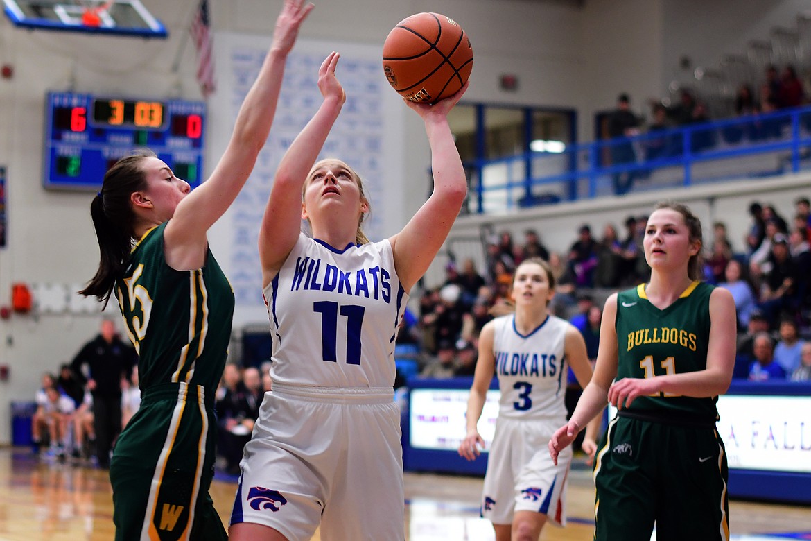 Savvy Ellis puts back a missed shot against the Lady Bulldogs Thursday. (Jeremy Weber photo)