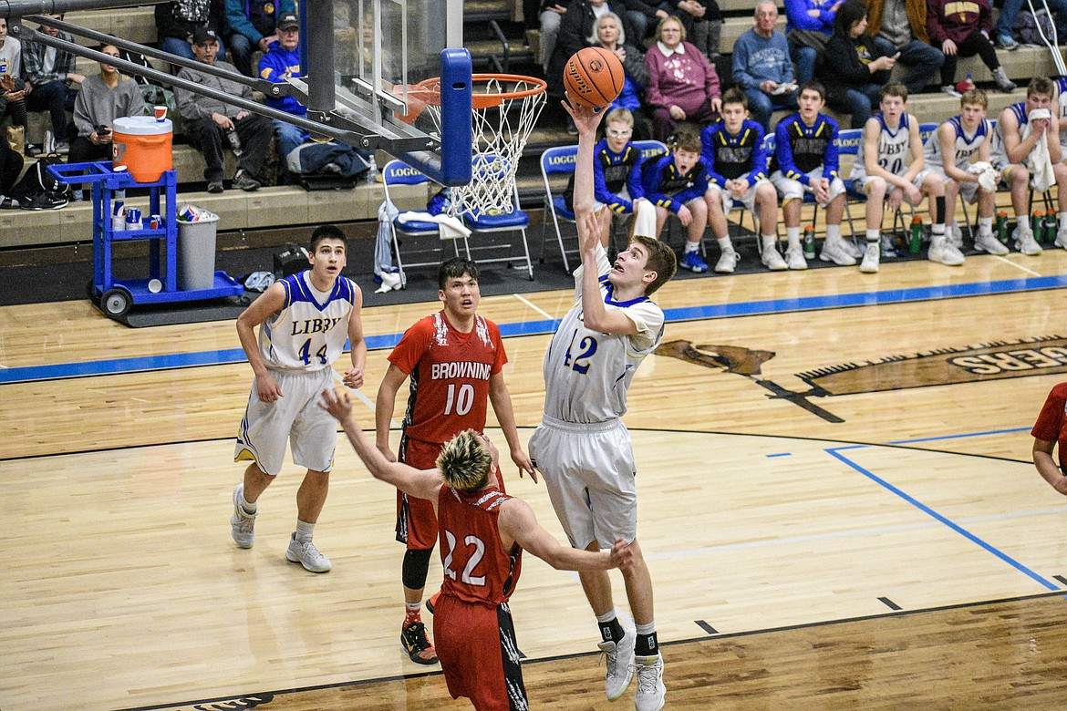 Libby junior Keith Johnson goes for a layup midway through  through the third quarter against Browning Saturday. (Ben Kibbey/The Western News).