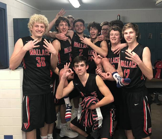 Courtesy photo
The Wallace Miners celebrate with teammate Zach Welch in the locker room after he notched a career-high 52 points against Clark Fork.