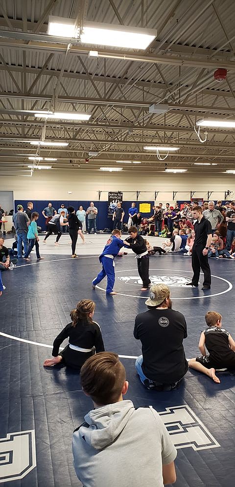 Colt Barras (in blue) competes in Spokane.