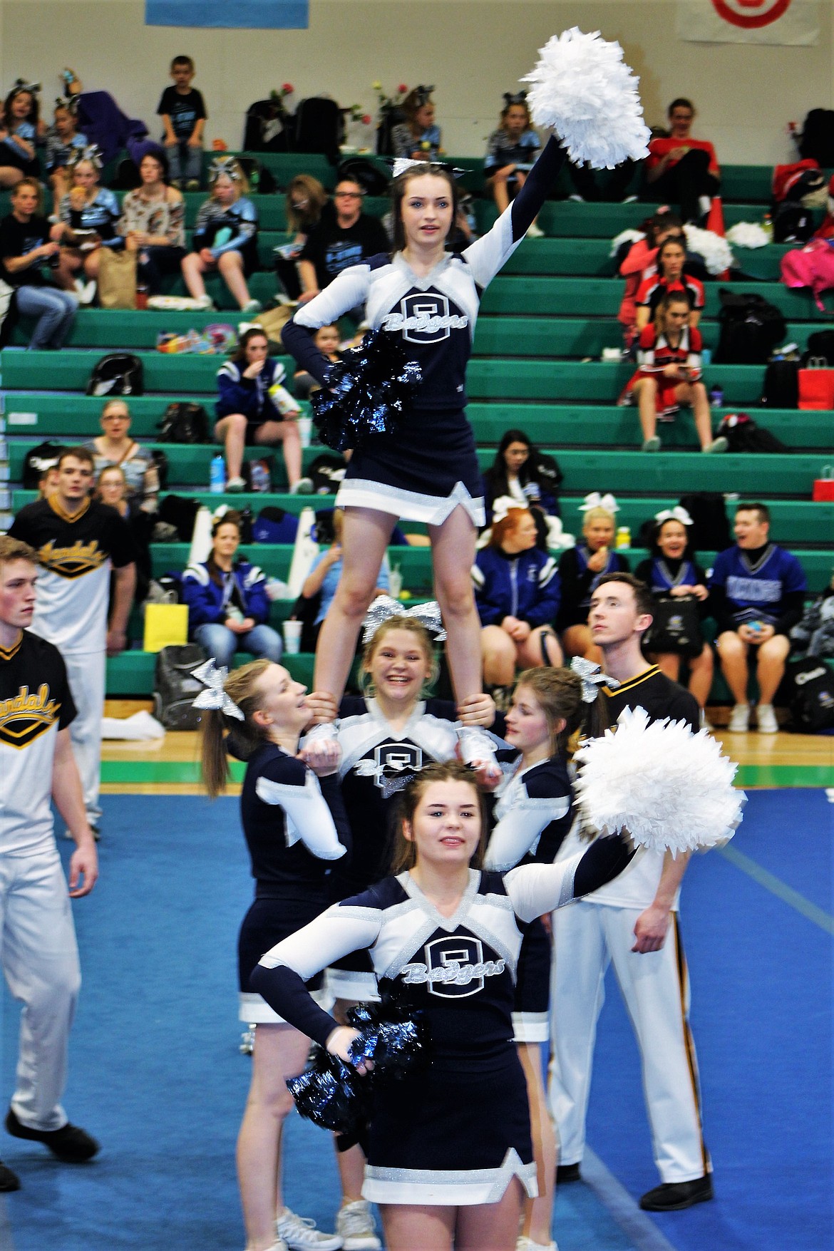 Kylie Underhill is boosted by her teammates as the Badger cheerleaders compete at the Prairie Classic event.