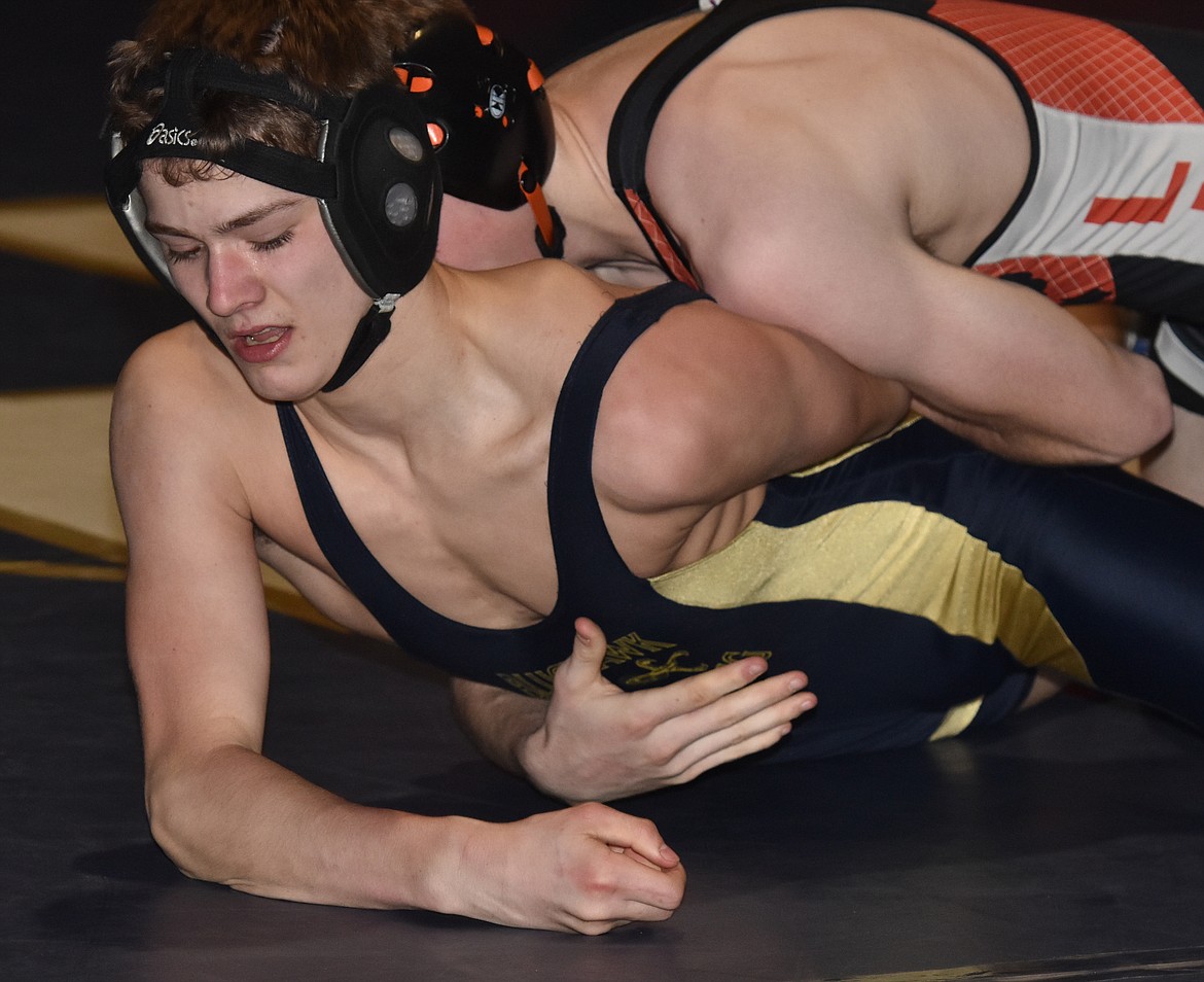 Thompson Falls/Noxon freshman Shane Reishus works to escape from Kyle Durden of Lincoln County-Eureka during the 126-pound title match at the Western B-C Divisional. Reishus finished second and wrestles at the state tournament this weekend in Billings.