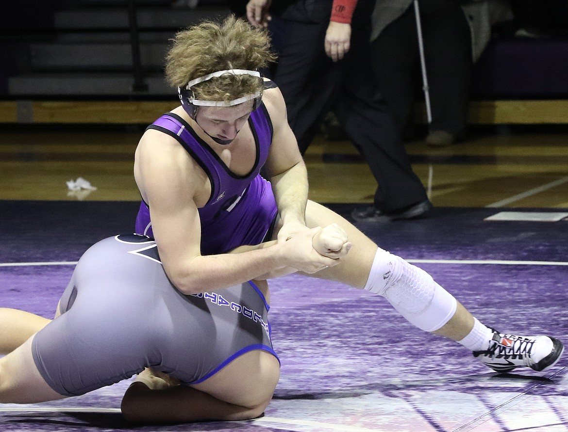 Polson senior Hunter Fritsch, getting a grip on his opponent, captured the 170-pound title at the Western A Divisional tourney. He pinned Ryan RunningCrane of Browning in just 36 seconds in the championship match. (Bob Gunderson/Lake County Leader)