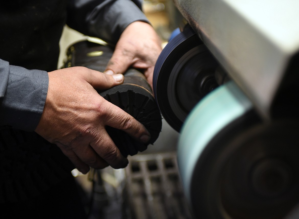 Don Thompson works with a pair of well-worn boots at Valley Boot and Saddle in Kalispell.