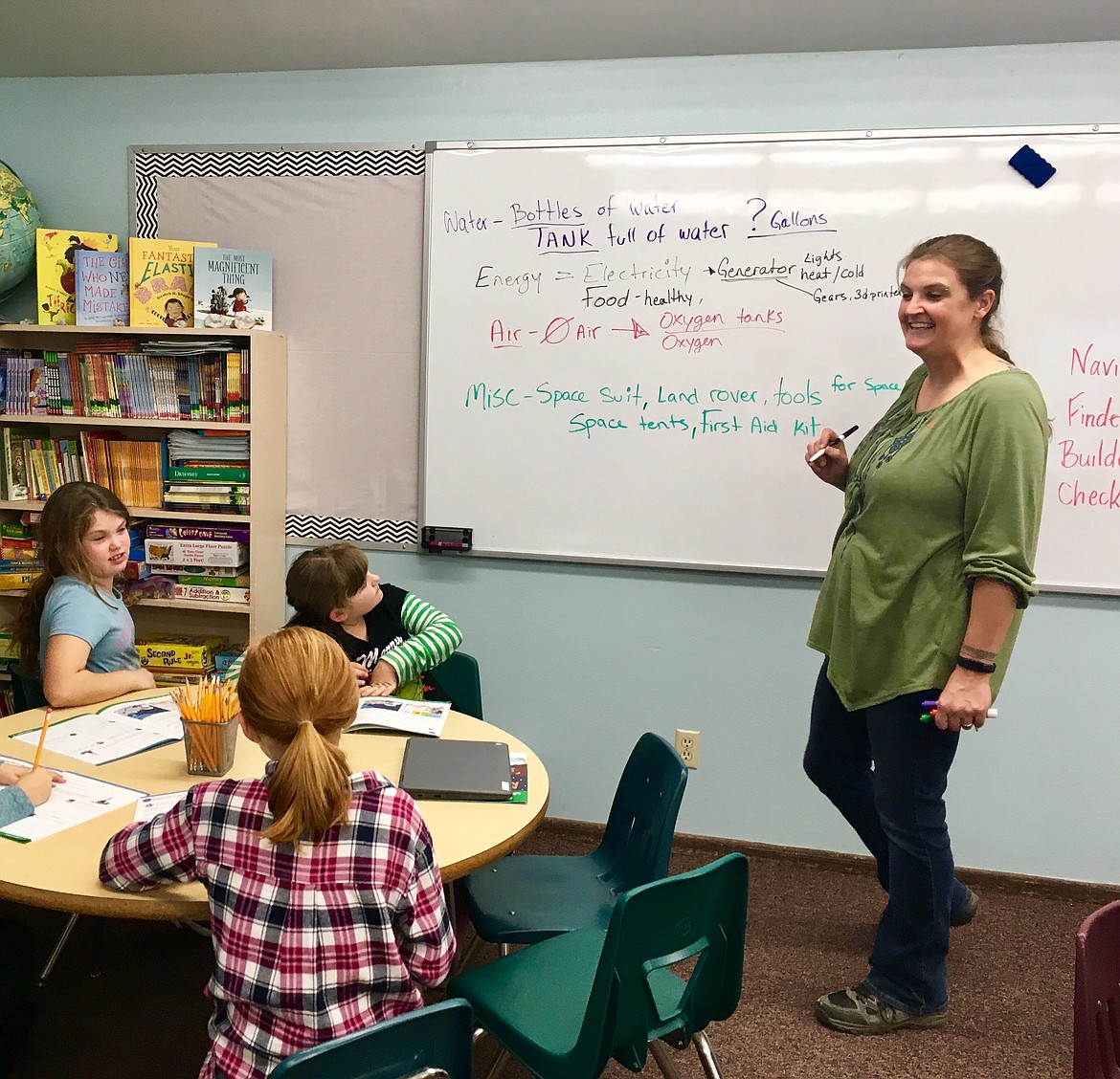 (Courtesy Photo)
Co-mentor Natalie Erickson works with the Robotics team.