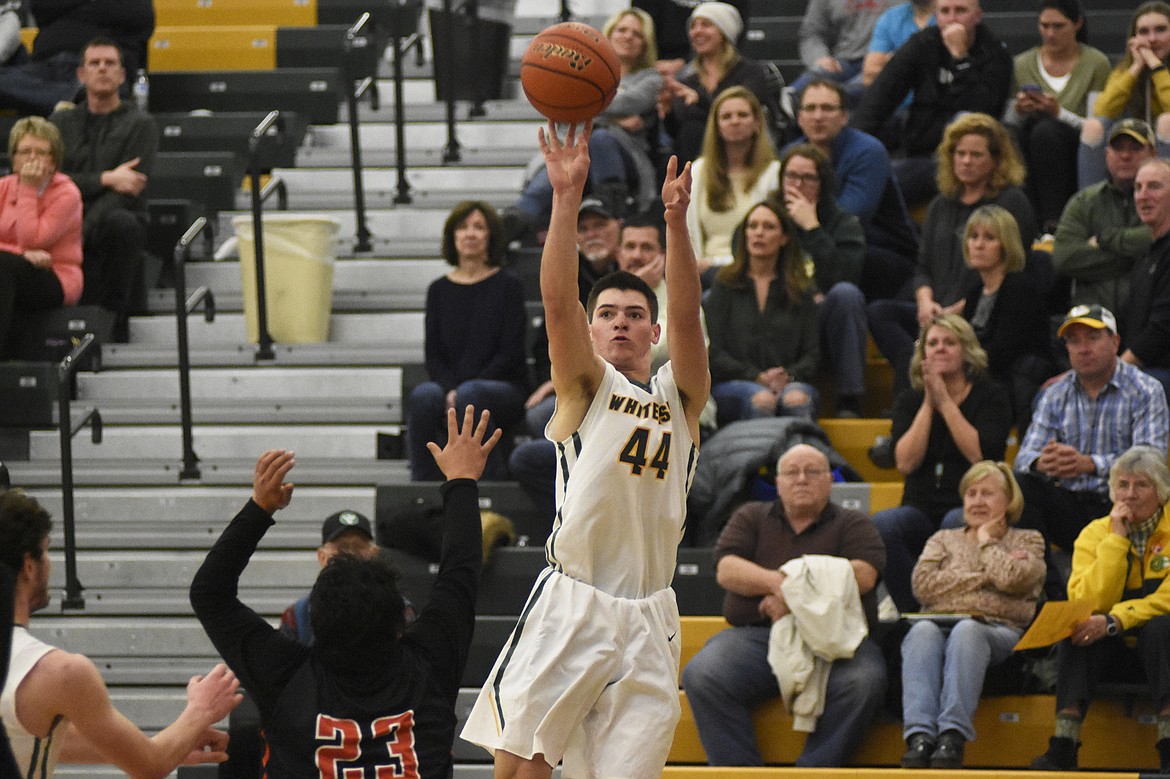 Lee Walburn launches a fade-away three during the Bulldogs' Senior Night victory over Ronan last Tuesday. (Daniel McKay/Whitefish Pilot)