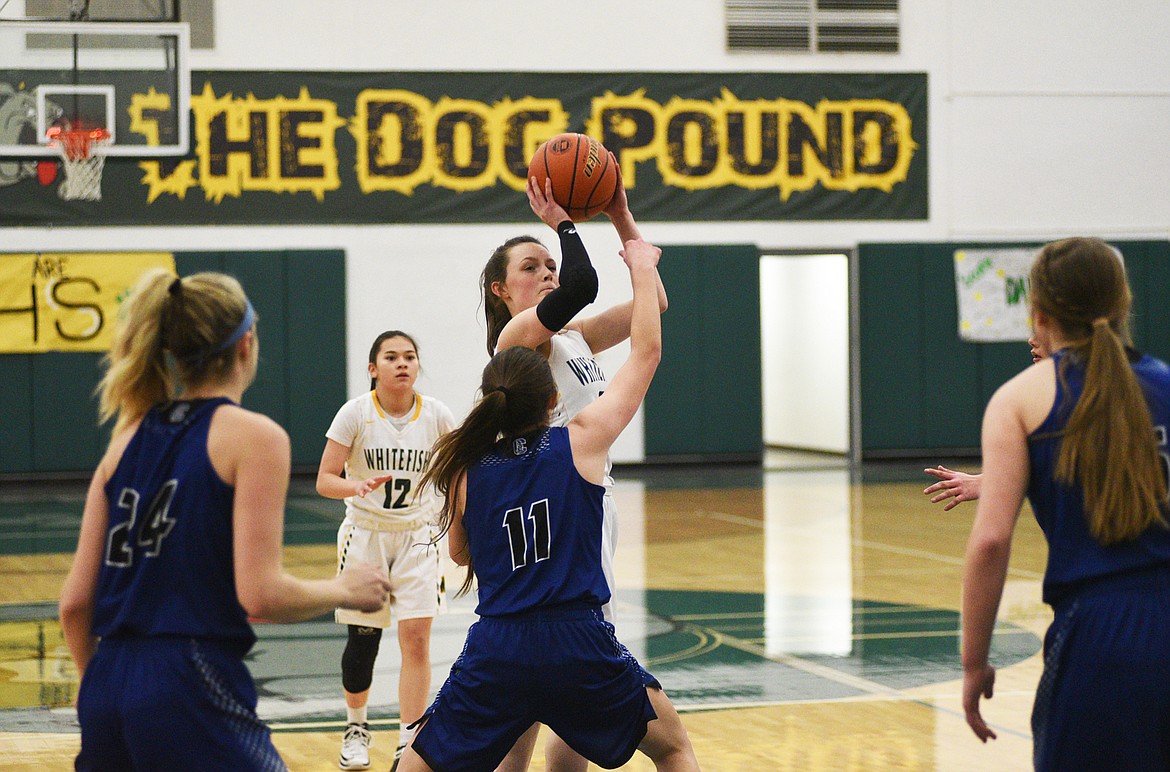 Kaiah Moore launches a mid-range jumper against Corvallis on Friday. (Daniel McKay/Whitefish Pilot)