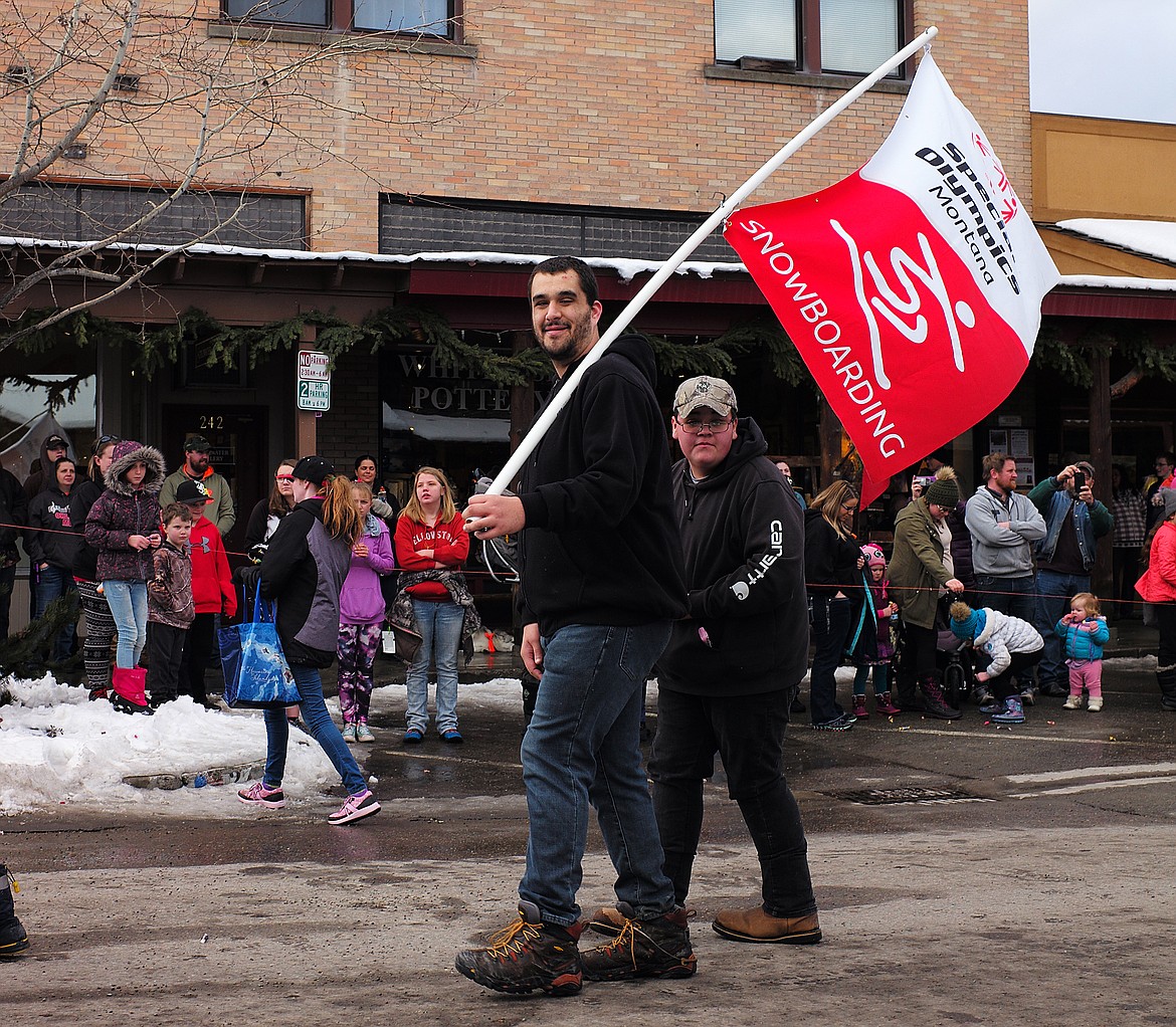 Tucker Negron walks through the parade.