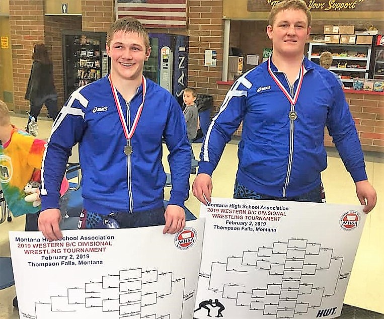 Clark Fork Mountain Cats Trey Green (182 pounds), left, and Jacob Lapinski (heavyweight) won first place at the B-C Divisional tournament in Thompson Falls on Feb. 2. Six members from the Cat team will advance to the State Wrestling Tournament in Billings this Friday and Saturday. (Photo courtesy of Toni Labbe)