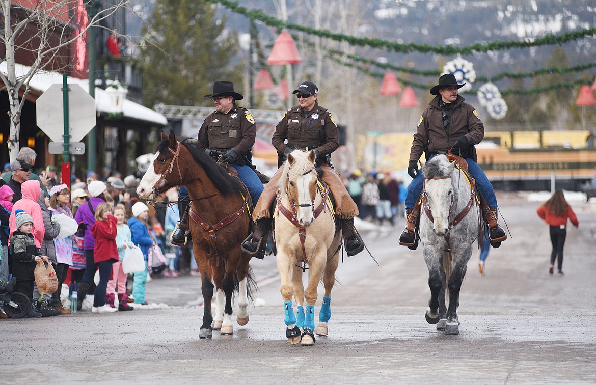 Whitefish Winter Carnival&#146;s 2019 Grand Parade on Saturday makes its way down Central Avenue. The theme was Whitefish Woodstock. (Heidi Desch/Whitefish Pilot)