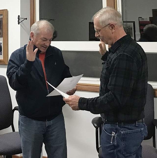 New Thompson Falls Mayor Jerry Lacy, left, is sworn in by council member Tom Eggensperger during a special meeting held Nov. 5. (Photo courtesy of Chelsea Peterson, City of Thompson Falls)