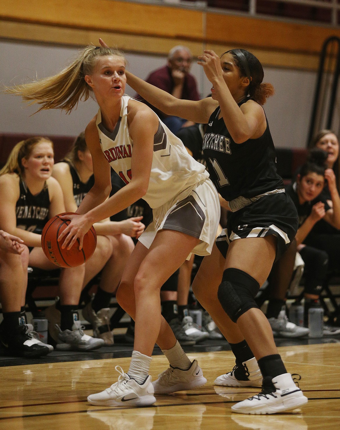 Sydnie Peterson of North Idaho College looks to pass while defended by Chasity Spady of Wenatchee Valley.