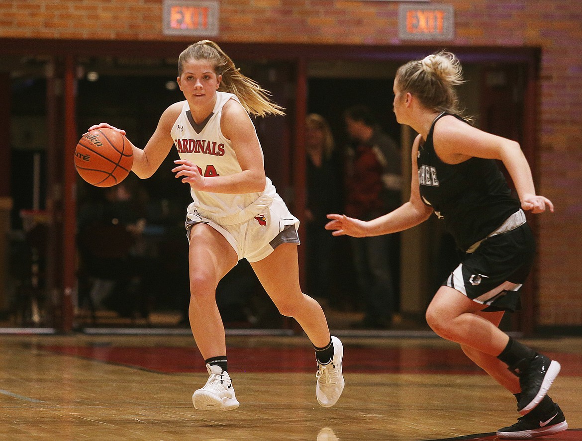 Alex Carlton of North Idaho College dribbles down the court while defended by Wenatchee Valley College&#146;s Kiara Steen during last Wednesday&#146;s game at NIC.