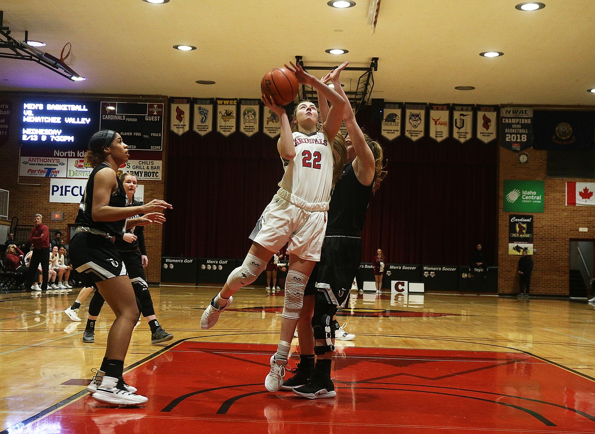 Anna Schrade of North Idaho College scores on a layup against Wenatchee Valley.