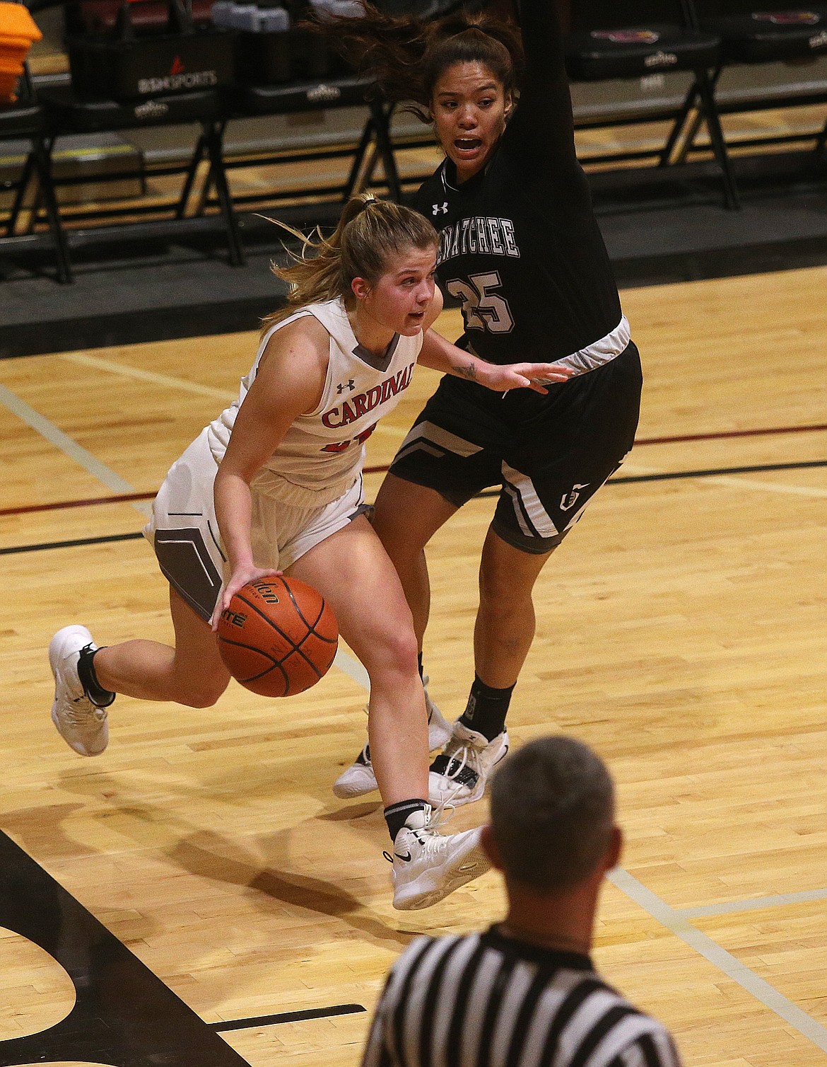 Alex Carlton of North Idaho College dribbles around Ashley Taylor Peralta of Wenatchee Valley.