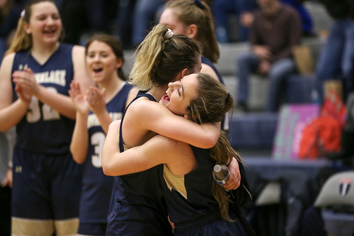 Photo by JASON DUCHOW PHOTOGRAPHY
McKeeley Tonkin, left, and Taryn Soumas hug in celebration of their third-place victory over Homedale at the state 3A girls basketball tournament Saturday at Nampa High.