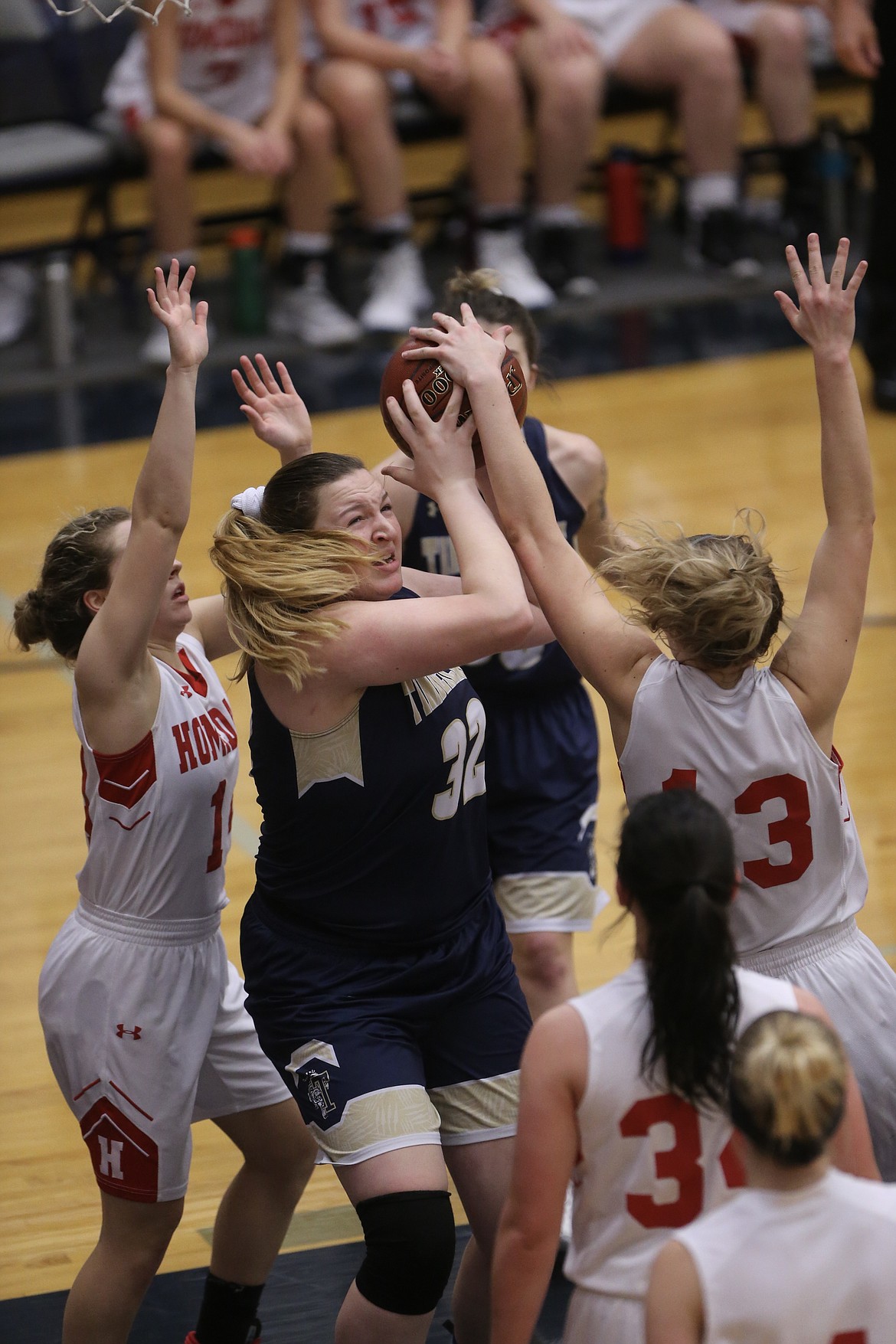 Photo by JASON DUCHOW PHOTOGRAPHY
Blayre Jeffs of Timberlake tries to fight through two Homedale defenders under the hoop in the third-place game of the state 3A girls basketball tournament Saturday at Skyview High in Nampa.