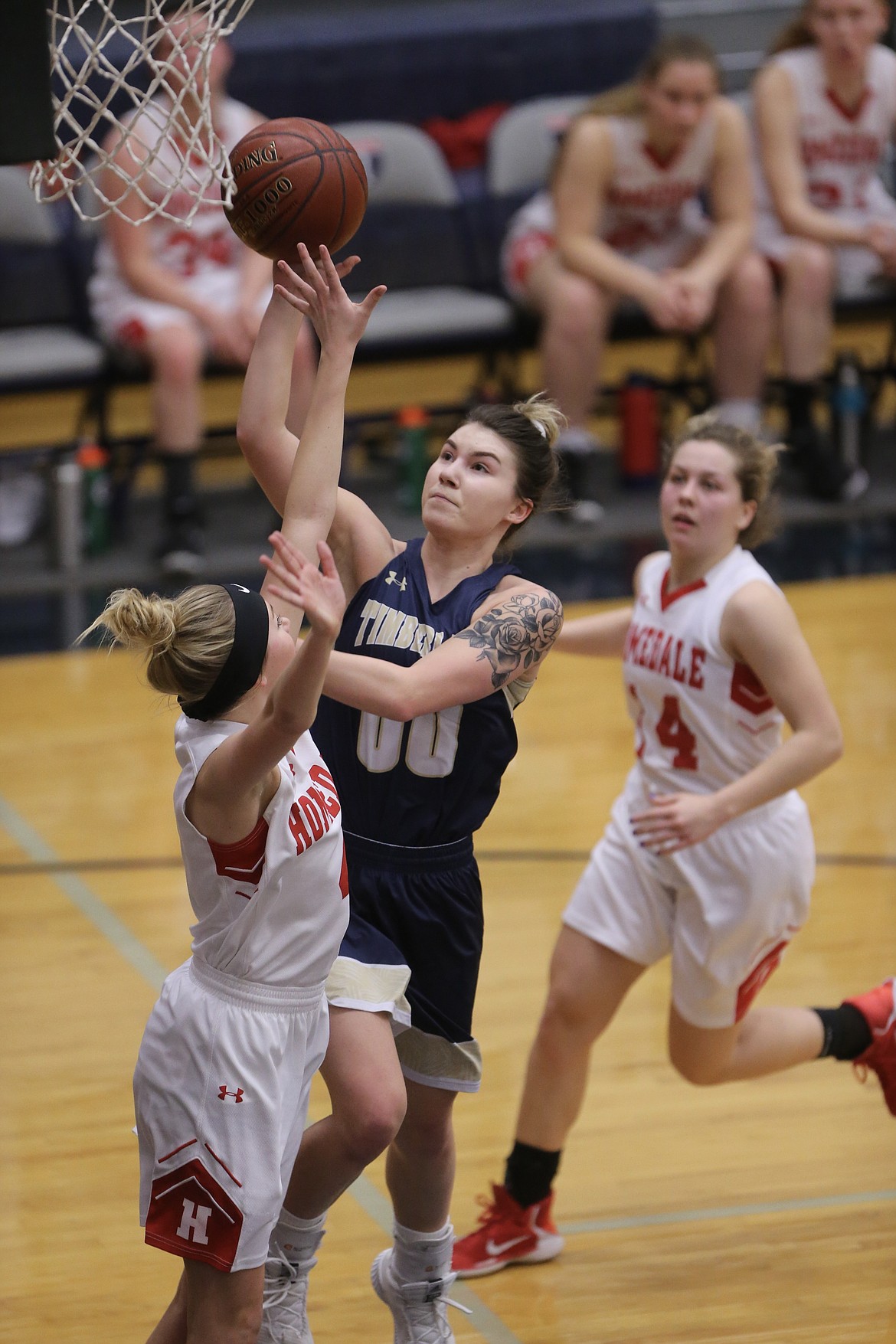 Photo by JASON DUCHOW PHOTOGRAPHY
McKeeley Tonkin of Timberlake goes to the hoop over Homedale&#146;s Jayci Swallow in the third-place game of the state 3A girls basketball tournament Saturday at Skyview High in Nampa.