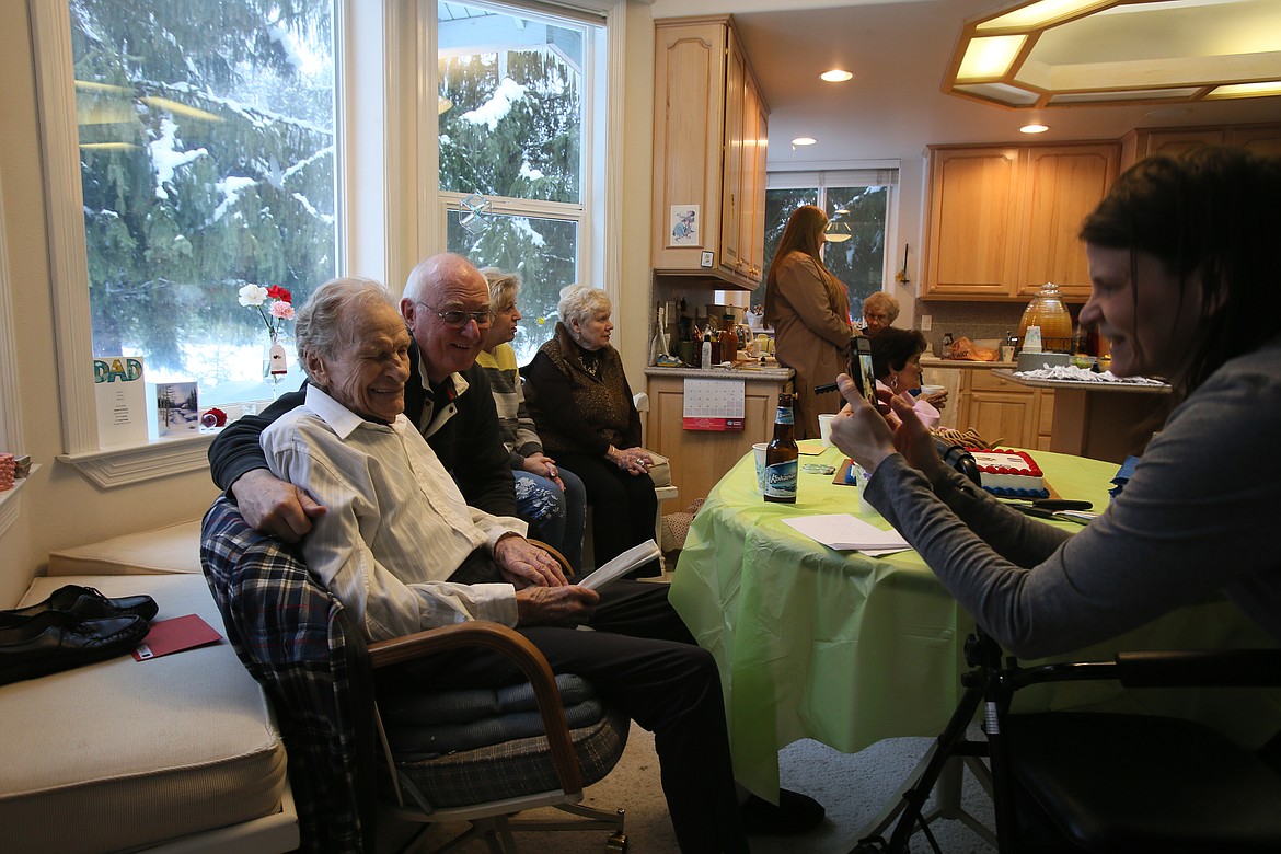 Birthday boy Elmer Currie winks at the camera Saturday as he and long-time friend Tom Lien have their photo taken by Currie&#146;s granddaughter Crystal Scott. (DEVIN WEEKS/Press)