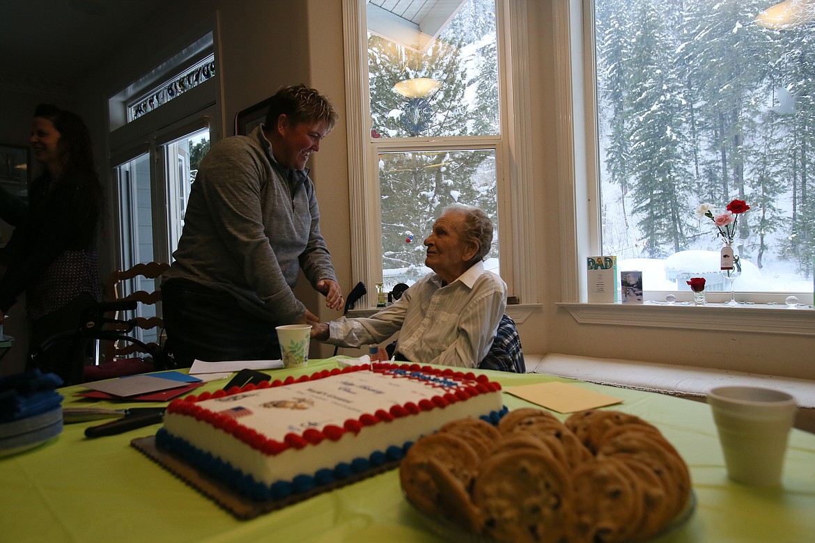 Jennifer Currie wishes her grandpa Elmer Currie a happy birthday during a party Saturday. Elmer, a WWII veteran and former Kootenai County commissioner, turned 99 years young on Wednesday. (DEVIN WEEKS/Press)