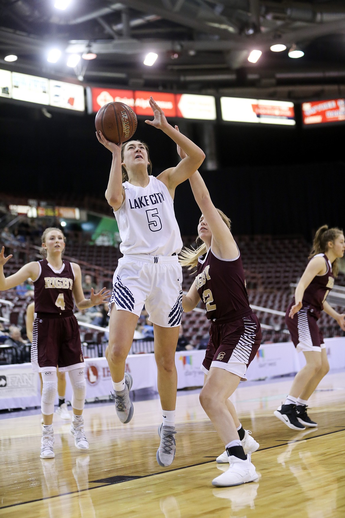 Photo by JASON DUCHOW PHOTOGRAPHY
Bridget Rieken of Lake City scores two of her game-high 21 points against Rigby on Friday in a loser-out game of the state 5A girls basketball tournament Friday at the Ford Idaho Center in Nampa.