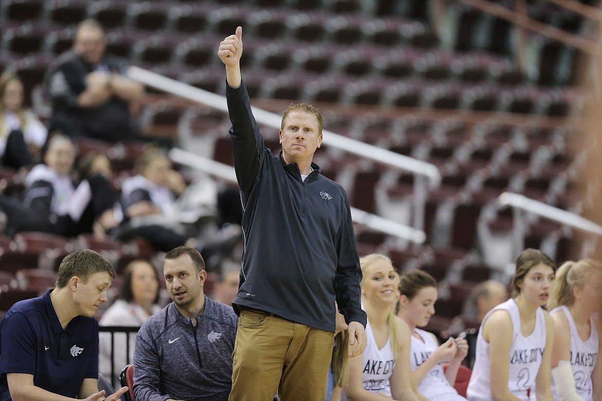 Photo by JASON DUCHOW PHOTOGRAPHY
Lake City coach James Anderson signals a play to his team Friday during a loser-out game vs. Rigby at the state 5A girls basketball tournament at the Ford Idaho Center in Nampa.