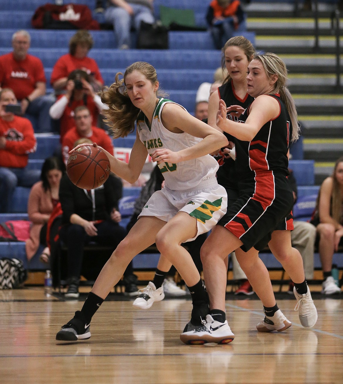 Photo by JASON DUCHOW PHOTOGRAPHY
Taylor Elpers of Lakeland dribbles past a Hillcrest defender on her way to the hoop Friday in a loser-out game of the state 4A girls basketball tournament at Timberline High in Boise.