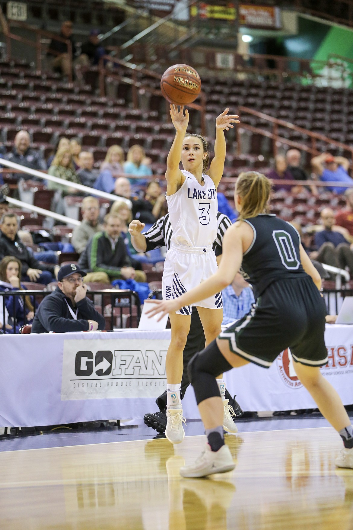 Lake City&#146;s Klaire Mitchel drains  a 3 point shot from beyond the NBA arc in the 4th quarter