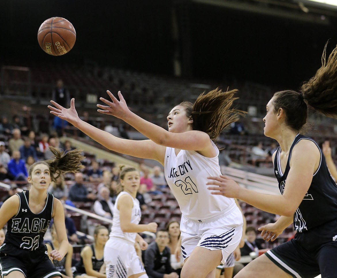 Photo by JASON DUCHOW PHOTOGRAPHY
Brooklyn Rewers of Lake City reaches for an offensive rebound Thursday against Eagle in the first round of the state 5A girls basketball tournament Thursday at the Ford Idaho Center in Nampa.