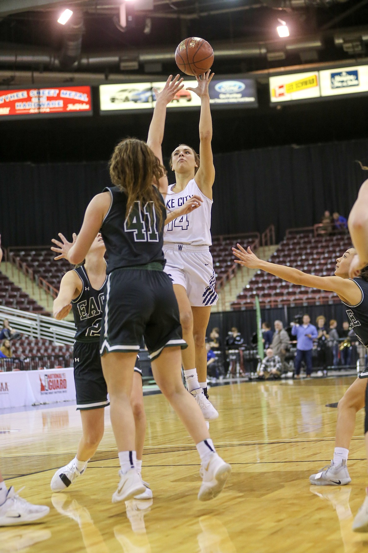 Photo by JASON DUCHOW PHOTOGRAPHY
Dejah Wilson of Lake City floats a shot over two Eagle defenders, including Gabi Peters (41), on Thursday in the first round of the state 5A girls basketball tournament at the Ford Idaho Center in Nampa.