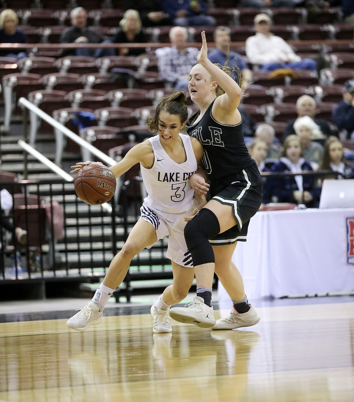 Photo by JASON DUCHOW PHOTOGRAPHY
Klaire Mitchell of Lake City drives past Eagle&#146;s Meghan Boyd on Thursday in the first round of the state 5A girls basketball tournament at the Ford Idaho Center in Nampa.