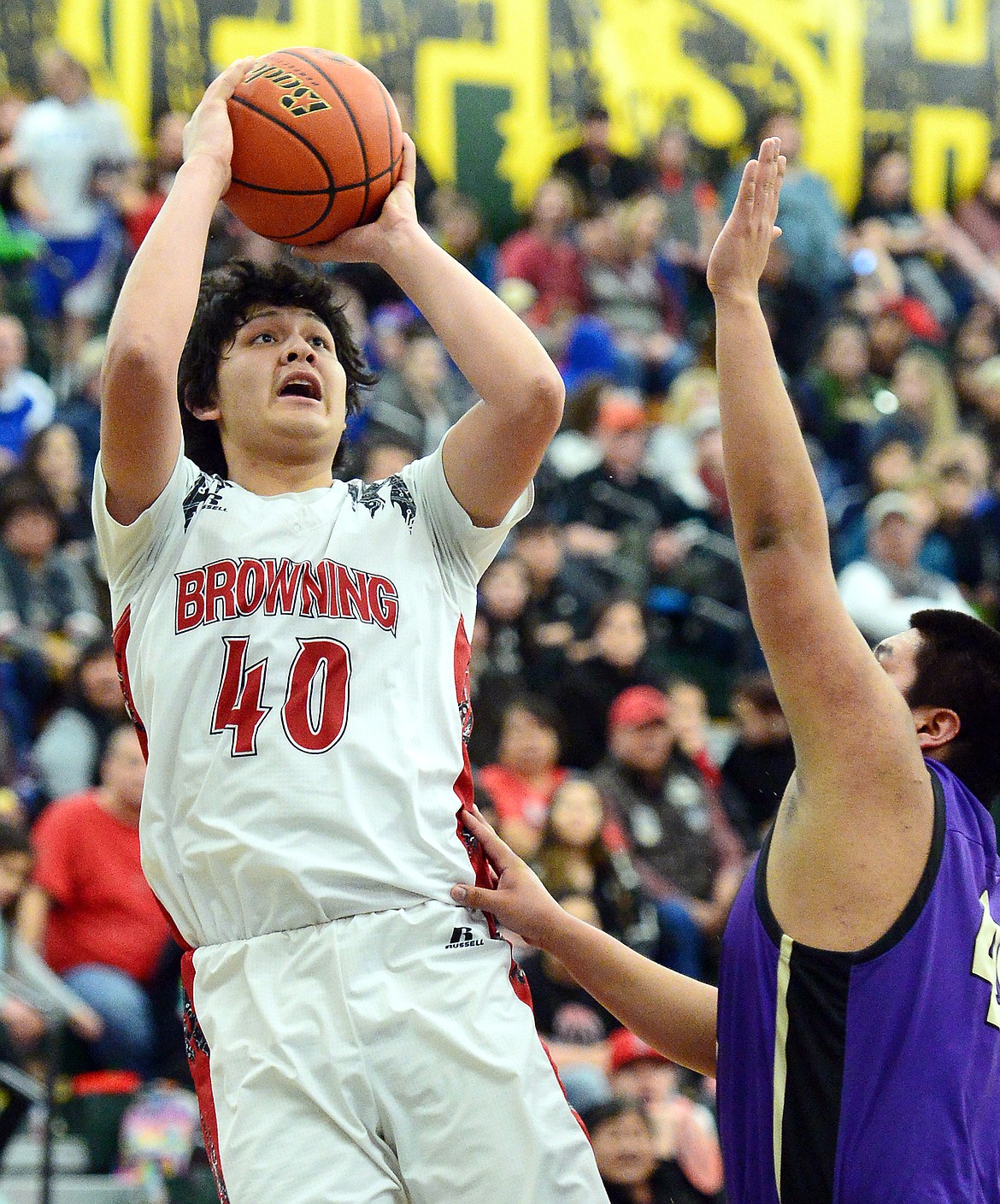 Browning's Tyree Whitcomb (40) shoots over Polson's Micah Askan (44) during the Northwest A District boys' championship game at Whitefish High School on Saturday. Browning won, 78-50. (Casey Kreider/Daily Inter Lake)