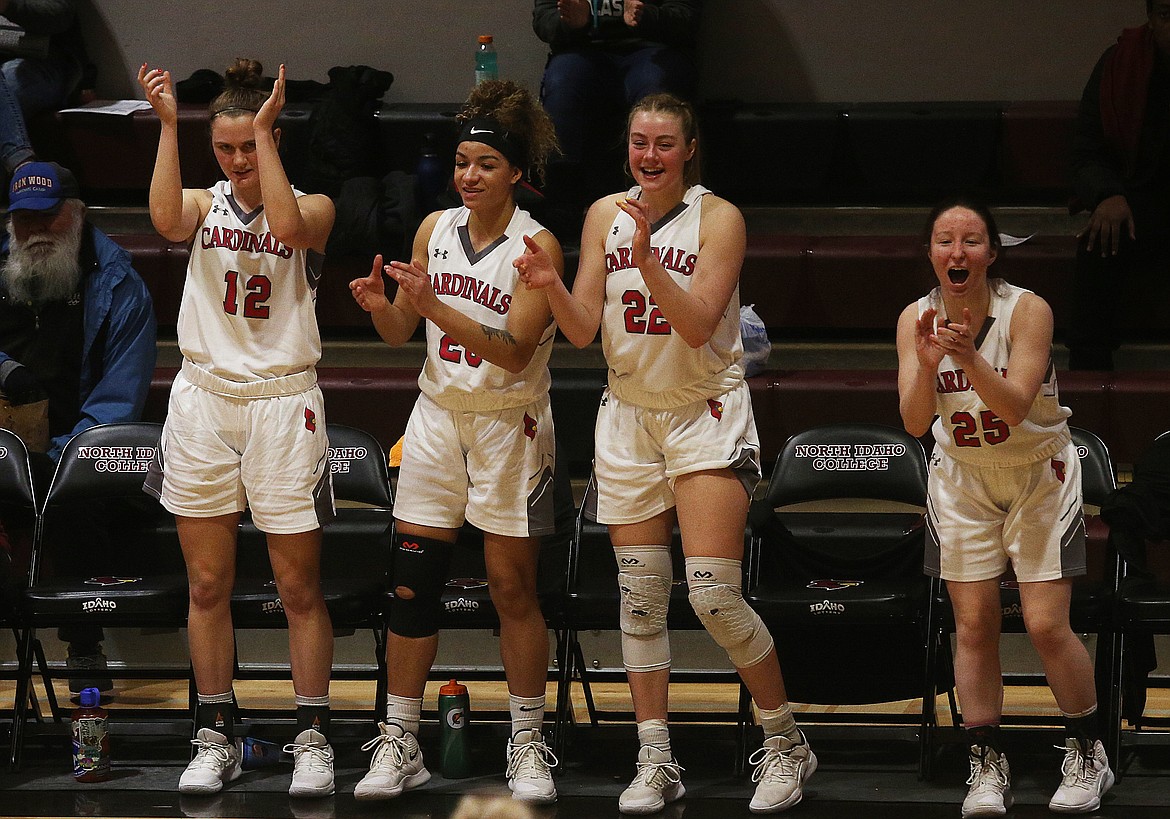 Lady Cards (from left) Zosha Krupa, Halle Eborall, Madison Lommen and Anna Schrade celebrate a three-pointer in the final minutes of Wednesday night&#146;s game against Wenatchee Valley College. (LOREN BENOIT/Press)