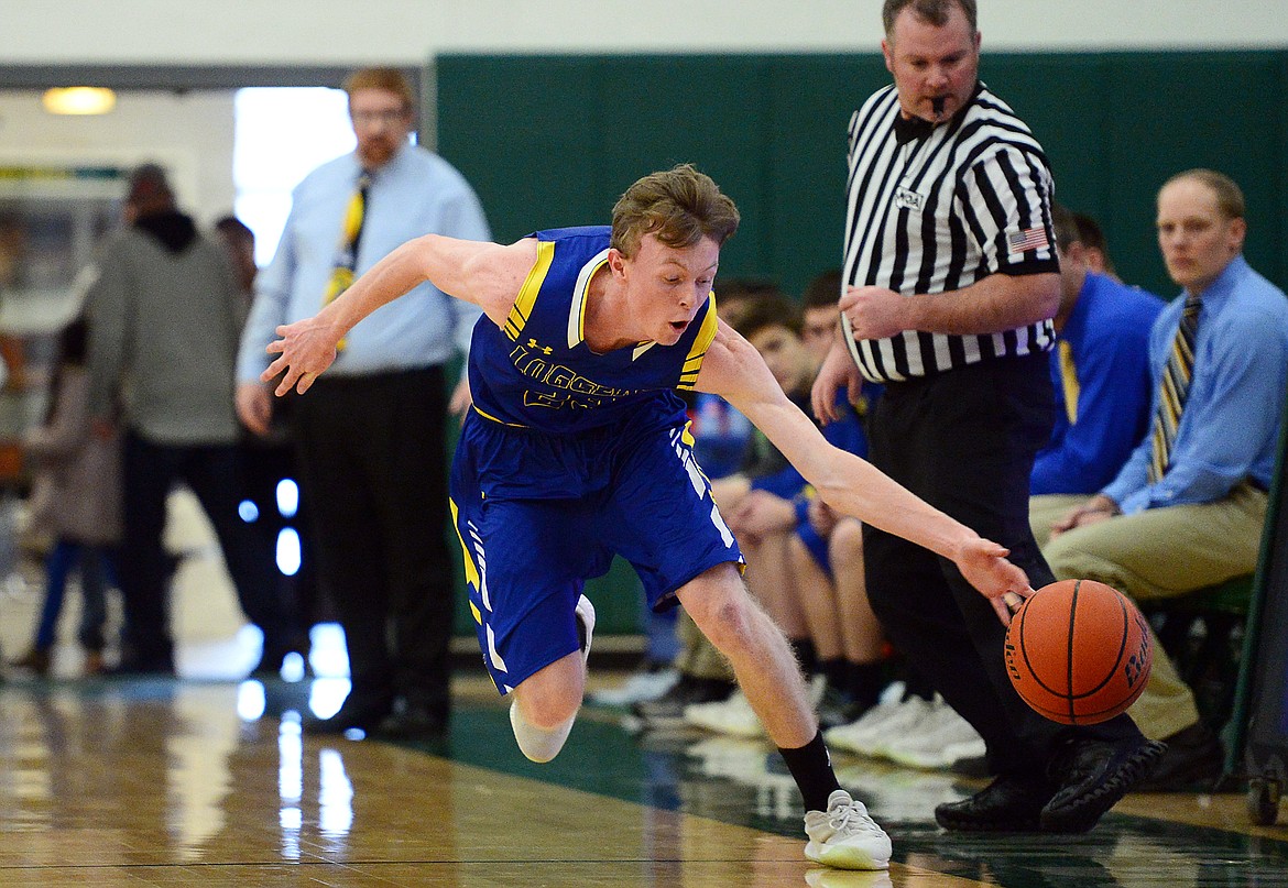 Libby's Ryggs Johnston (23) tries to keep a loose ball inbounds against Ronan at Whitefish High School on Thursday. (Casey Kreider/Daily Inter Lake)