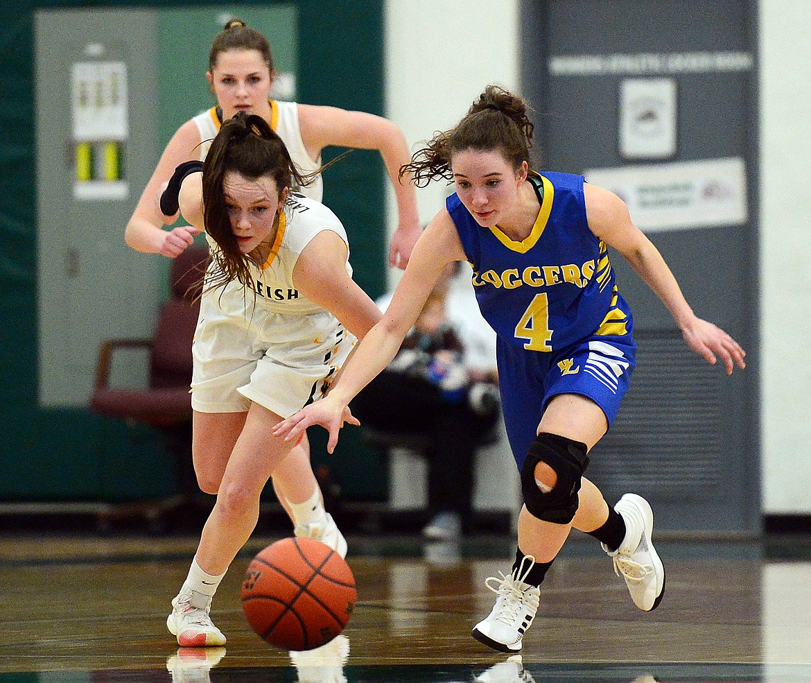 Libby's Emma Gruber (4) steals the ball from Whitefish's Kaiah Moore (2) at Whitefish High School on Thursday. (Casey Kreider/Daily Inter Lake)