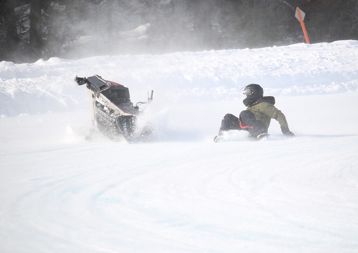 (Photo by MARY MALONE)
The icy track made for a tough race Saturday during the vintage snowmobile races at Priest Lake.