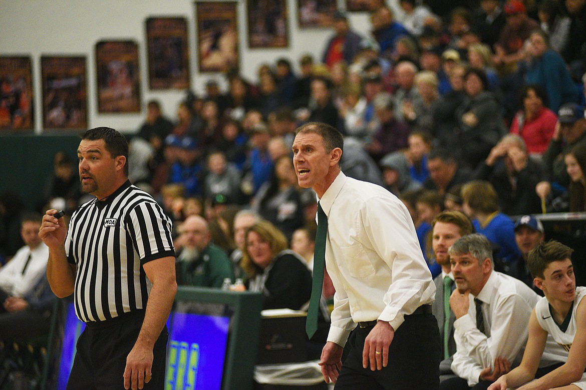 Head coach Scott Smith talks with a referee after a questionable call against Libby on Saturday in the third/fourth place game between Whitefish and Libby in the Class A District Tournament. (Daniel McKay/Whitefish Pilot)